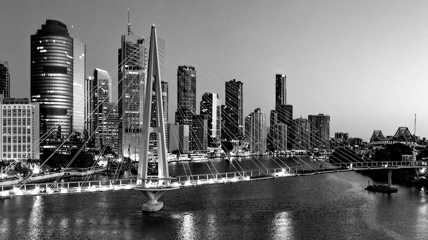Black-and-white Brisbane River skyline towards the Story Bridge, illustrating what global property trends mean for Queensland property investors